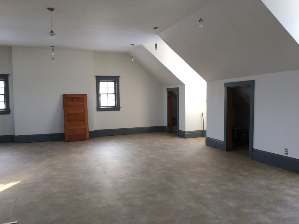 Empty studio apartment interior with clean walls, floor, and windows, emphasizing the need for move out cleaning services before vacating.